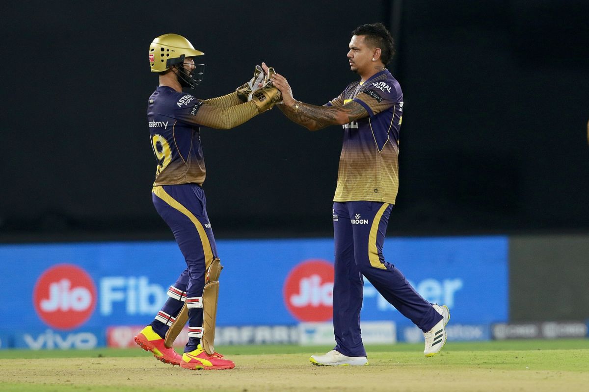 Dinesh Karthik and Sunil Narine celebrate a wicket