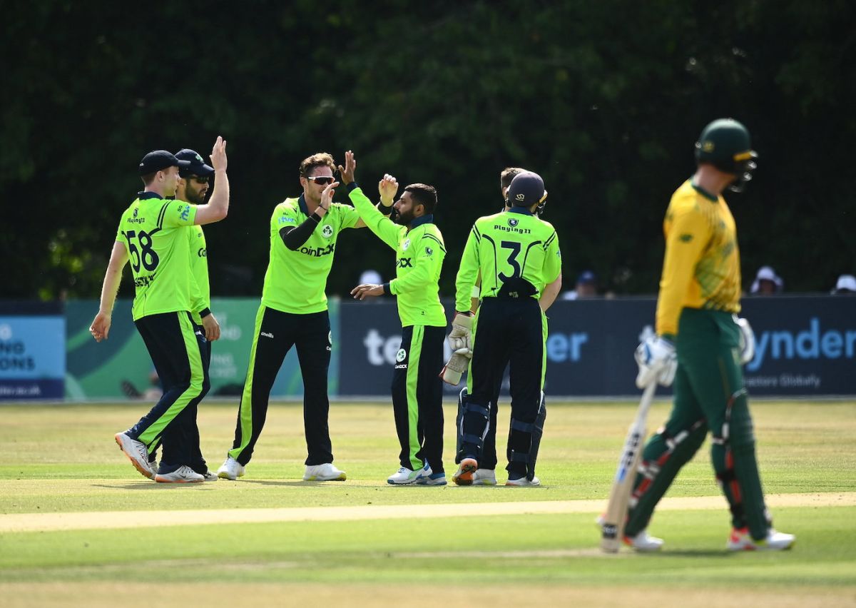 Simi Singh gets some high-fives after striking with his first ball ...