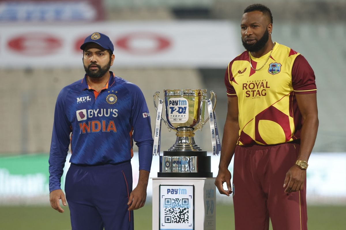 Rohit Sharma and Kieron Pollard pose with the trophy before the match ...