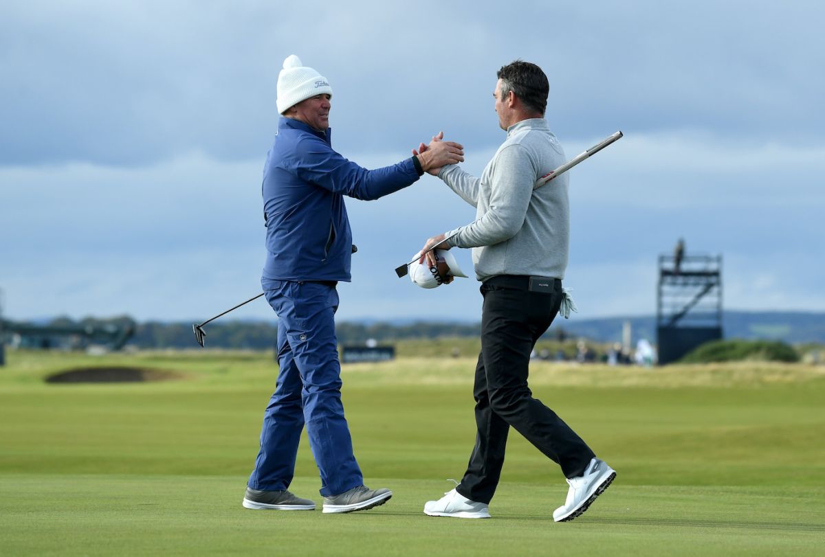 Shane Warne and partner, New Zealand golfer Ryan Fox, on their ninth