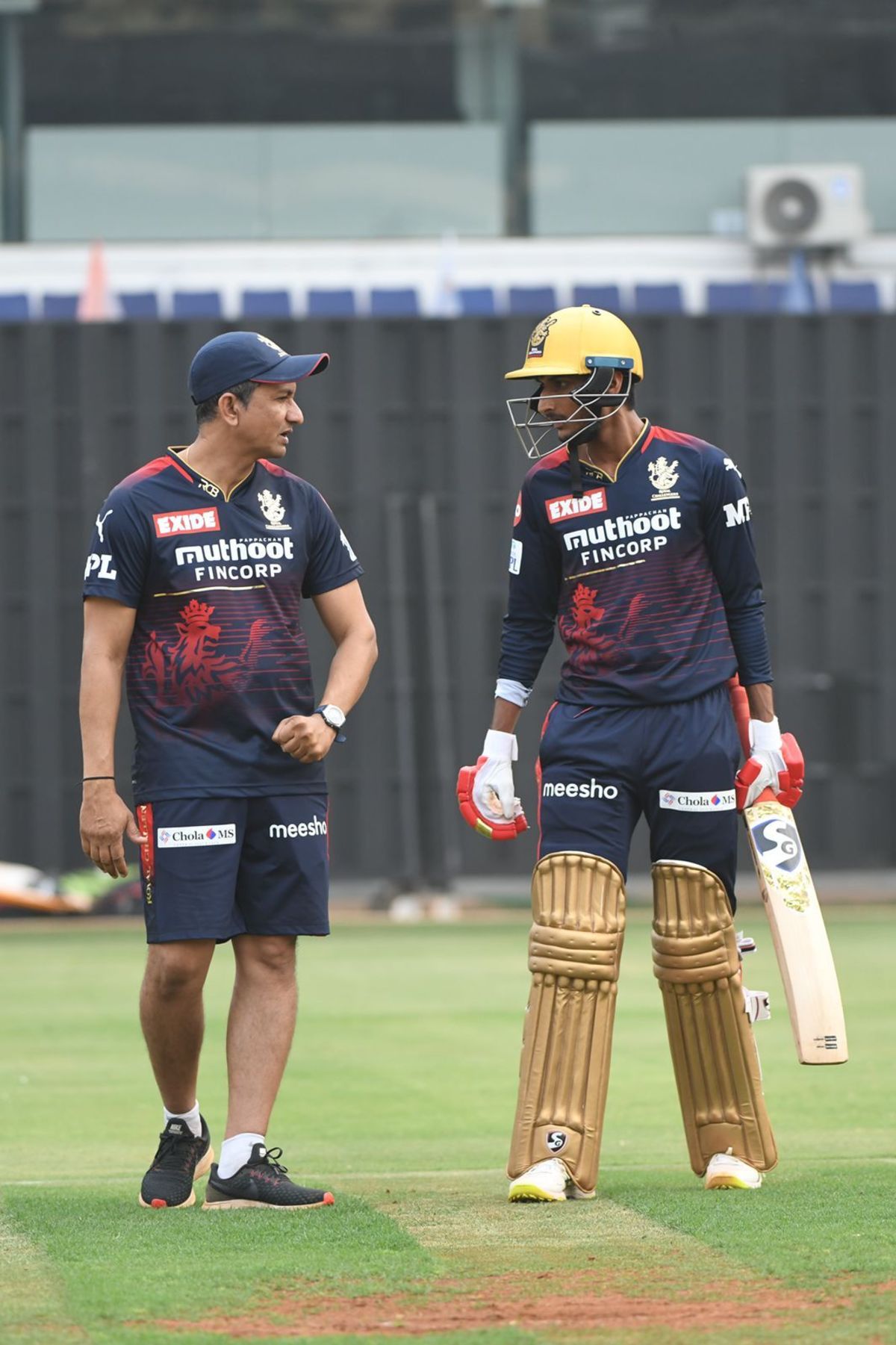 Shahbaz Ahmed chats with RCB head coach Sanjay Bangar at practice ...