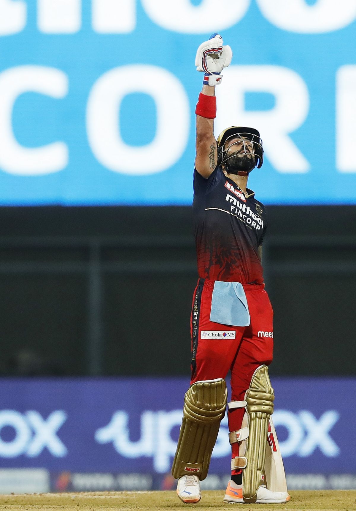 Virat Kohli makes it known how important the half-century was by gesturing  towards the sky 