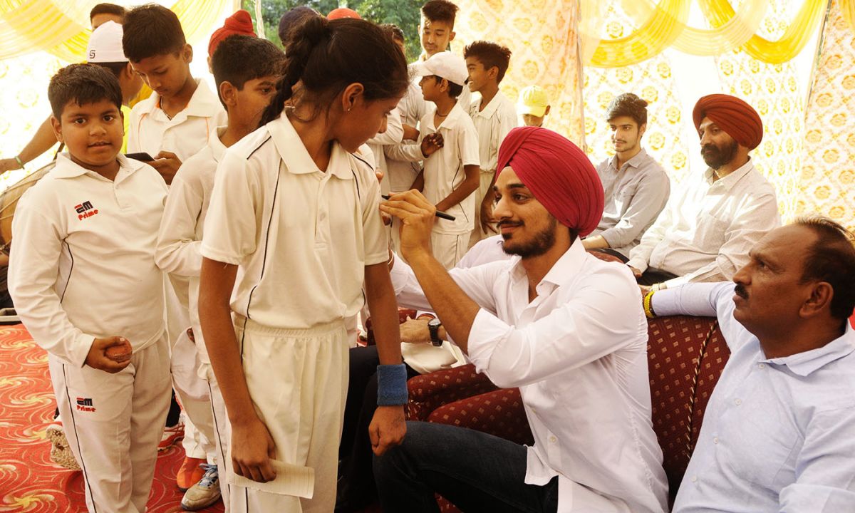 Arshdeep Singh signs autographs for kids at his academy in a school in Chandigarh, June 11, 2021