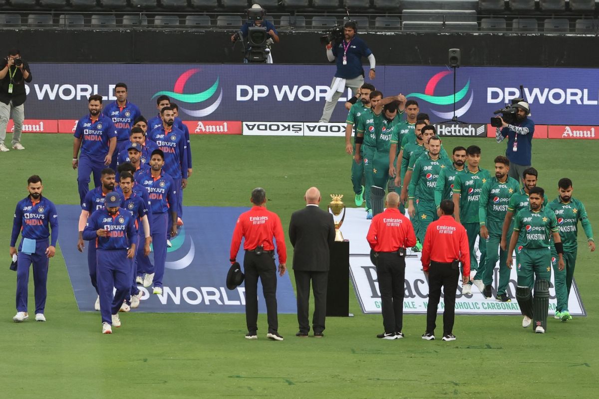 The India and Pakistan teams line up for their national anthems