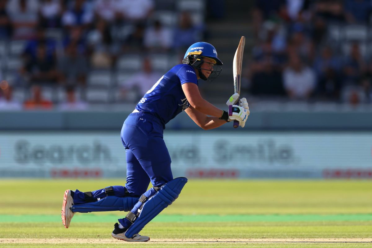 Najibullah Zadran raises his arms in triumph