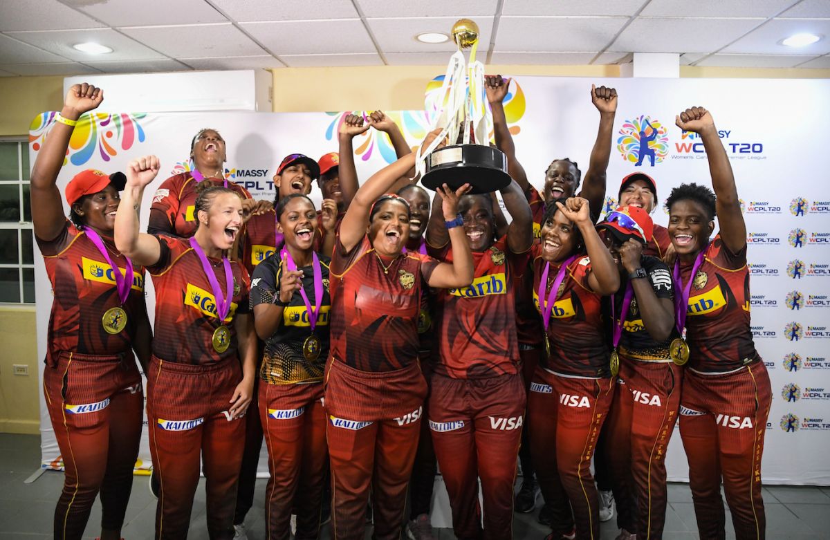 The Trinbago Knight Riders players celebrate with the trophy