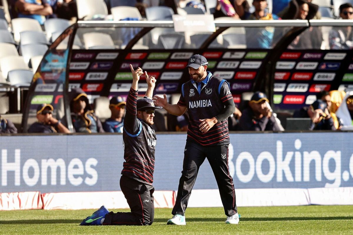 Jan Nicol LoftieEaton raises his arms in celebration after completing