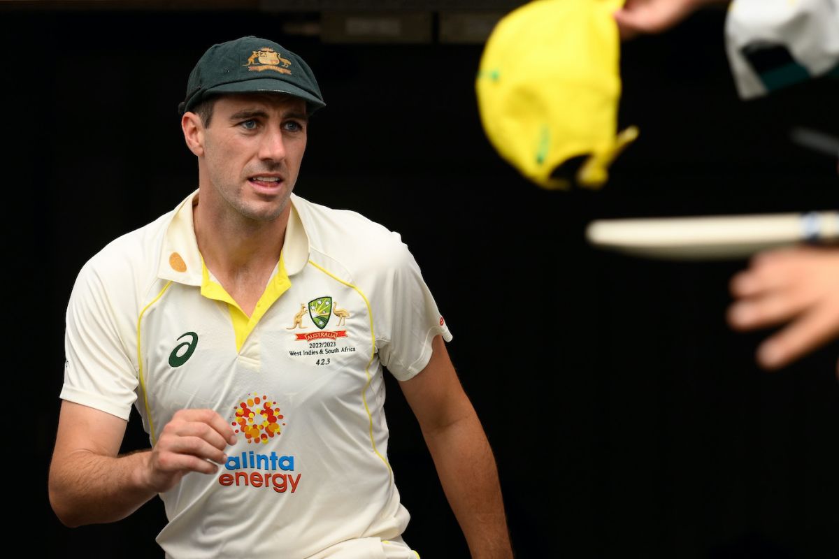 Pat Cummins and Travis Head celebrate after Dean Elgar's dismissal ...