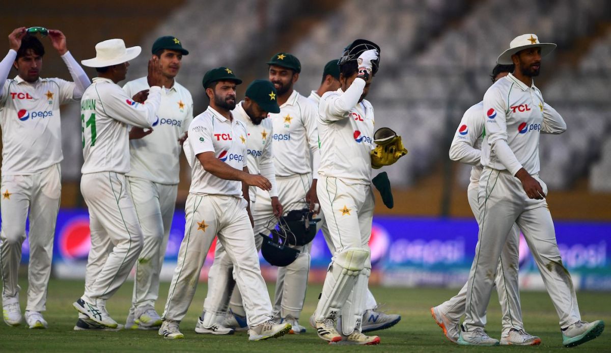 The Pakistan players walk off the field at stumps