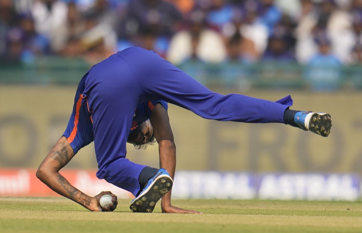 Hardik Pandya's one-handed return catch, low to his left, sends Devon ...