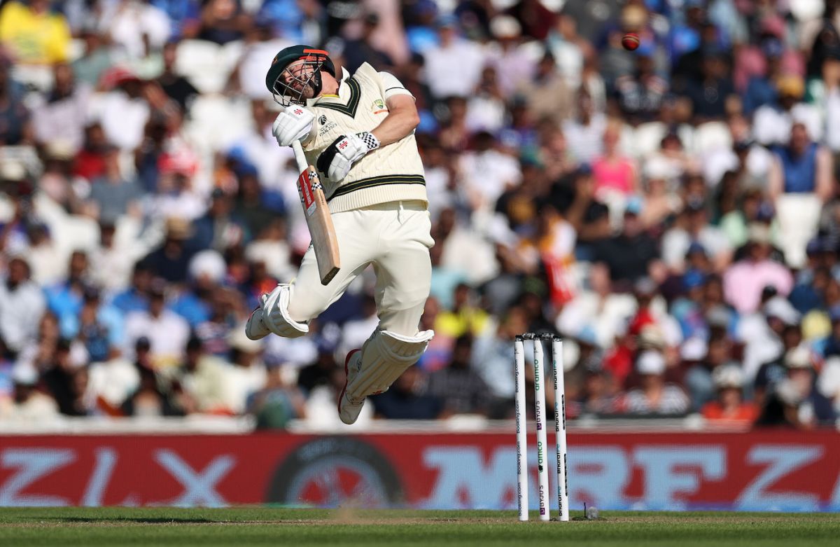Travis Head jumps in the air as he lets go of a short ball, Australia vs India, WTC final, day one, London, June 7, 2023 