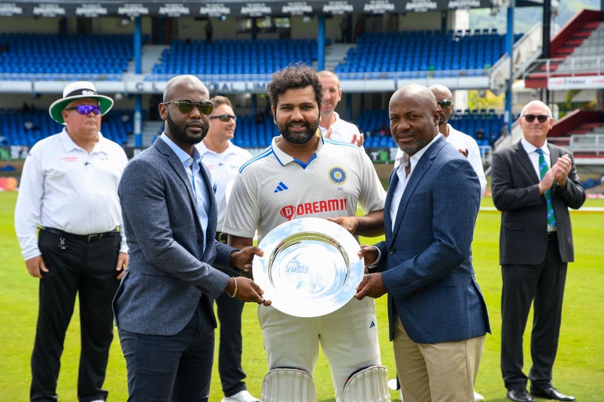 The India captain Rohit Sharma is presented a plaque to mark the 100th Test between West Indies and India, West Indies vs India, 2nd Test, first day, Port-of-Spain, July 20, 2023