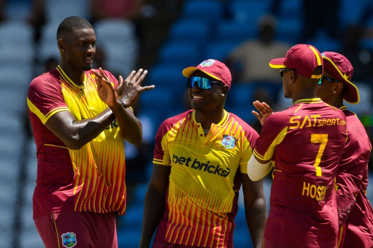 Jason Holder celebrates dismissing Suryakumar Yadav with his teammates