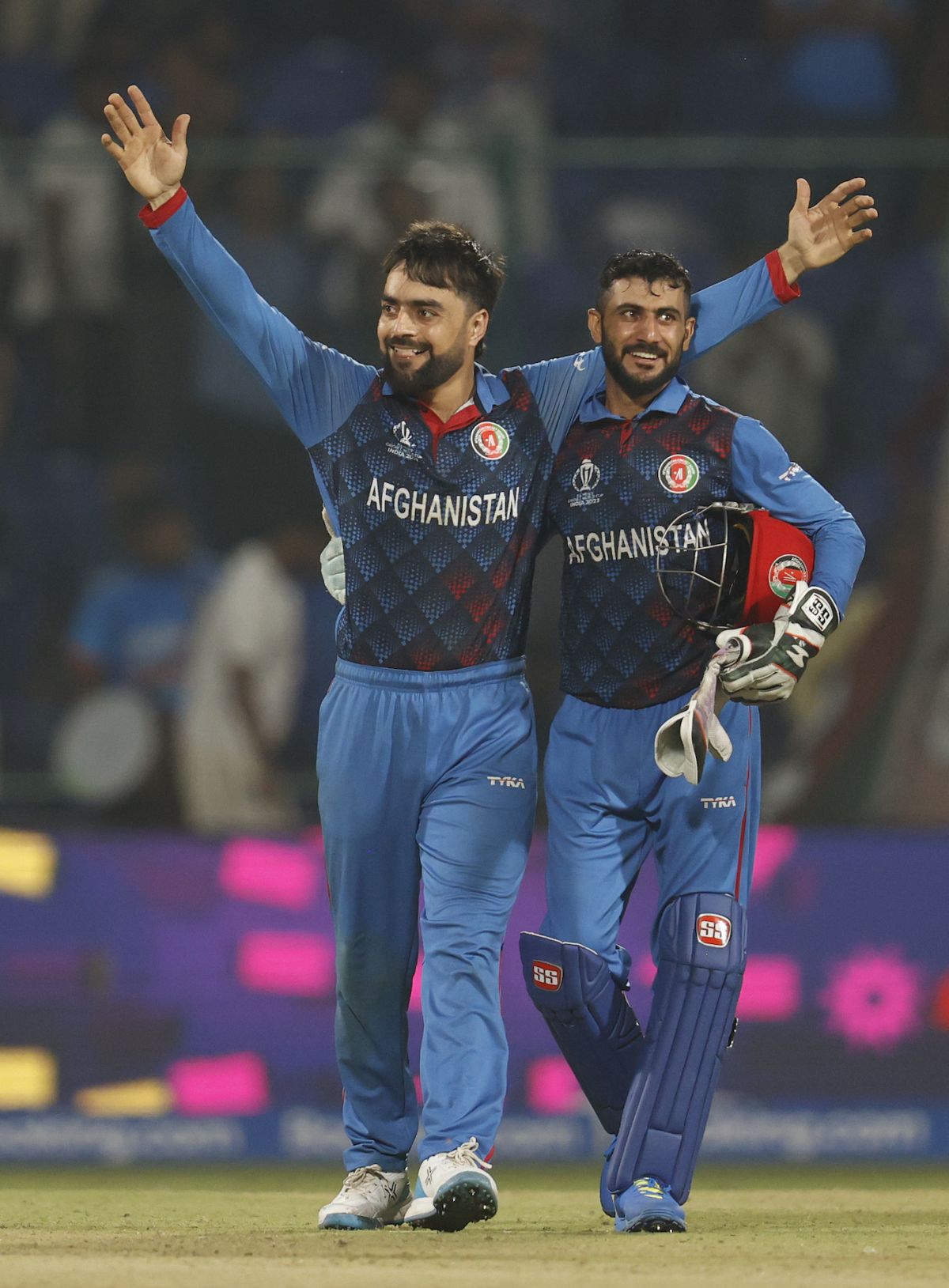 Rashid Khan and Ikram Alikhil - who both played big hands for Afghanistan - celebrate, Afghanistan vs England, World Cup, Delhi, October 15, 2023