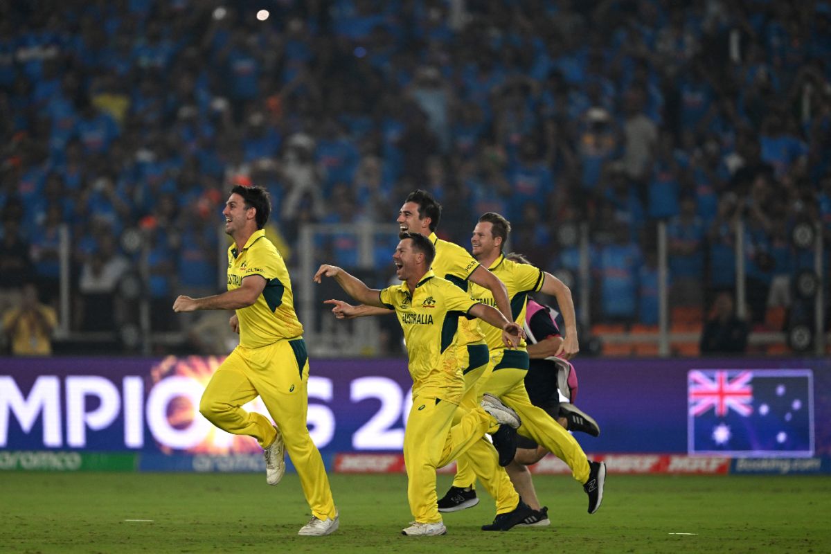Australia's players joyfully race onto the field to celebrate their World Cup final win, India vs Australia, Men's ODI World Cup final, Ahmedabad, November 19, 2023
