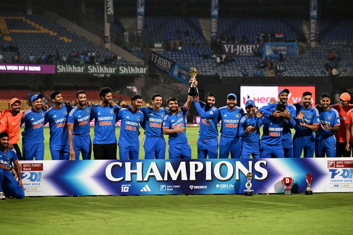 Newbies Rinku Singh and Jitesh Sharma hold the trophy aloft ...