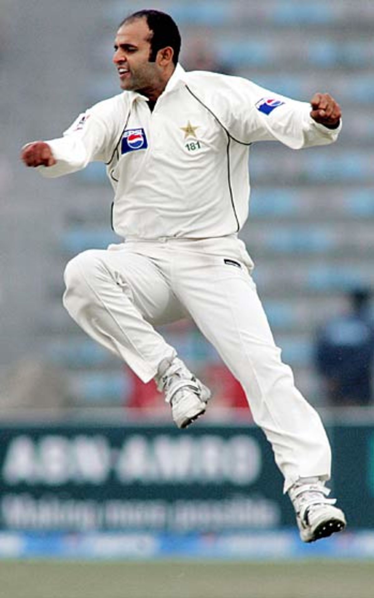 Naved-ul-Hasan whoops it up after dismissing Virender Sehwag for 254, India in Pakistan, 1st Test, Lahore, January 17, 2006
