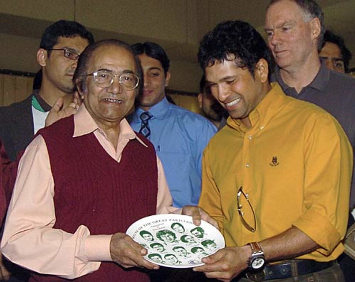 Sachin Tendulkar presents a shield to former Pakistan cricket captain Hanif Mohammad at The Arabian Sea Country Club in Karachi, January 27, 2006