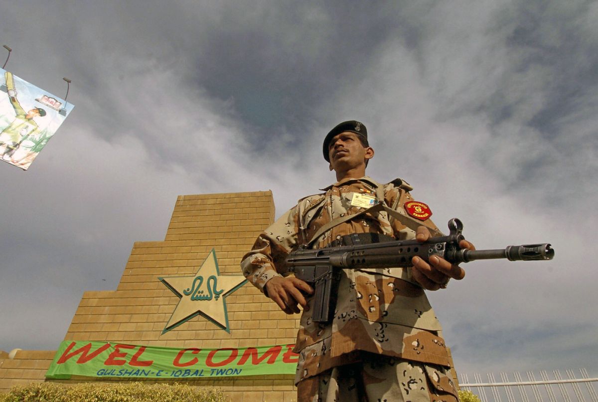 A security guard keeps watch outside the National Stadium ...