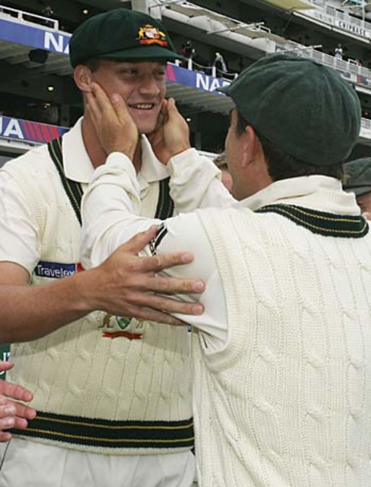 Stuart Clark is congratulated by Justin Langer afer receiving his Baggy Green , South Africa v Australia, 1st Test, Cape Town, March 16, 2006