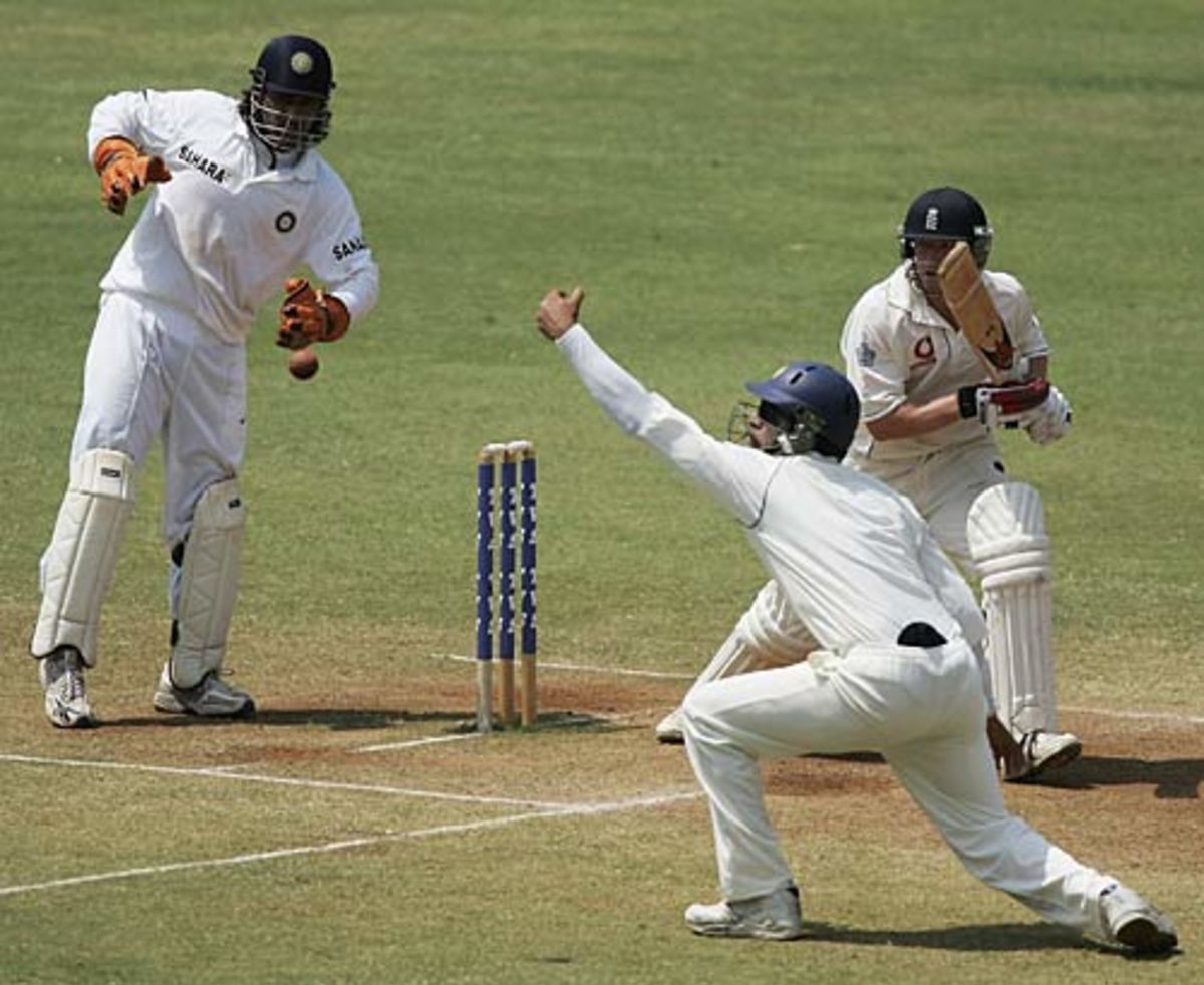 Paul Collingwood pushes the ball past Yuvraj Singh