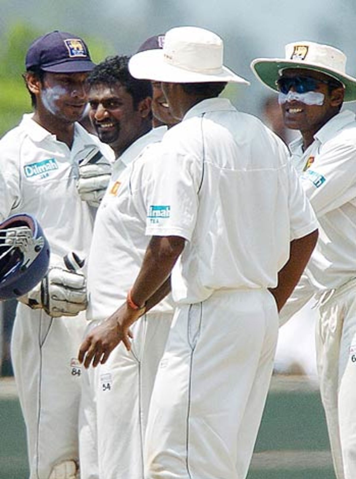 Sri Lankan Cricketers Surround Muttiah Muralitharan After A Strike