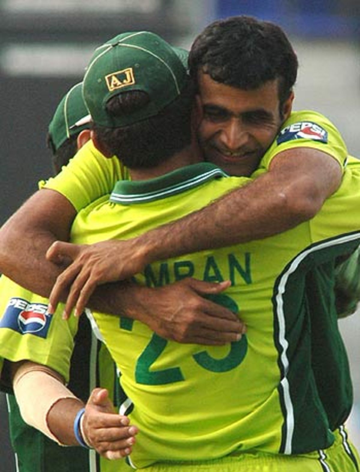 Rao Iftikhar Anjum and Imran Farhat celebrate the wicket of Yuvraj ...