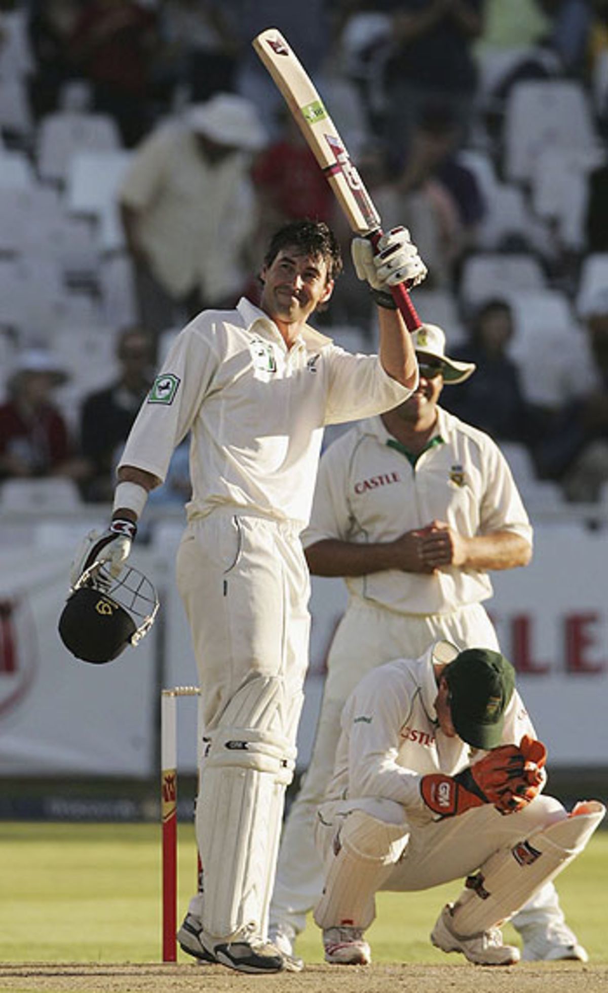 Stephen Fleming celebrates his ninth Test century, on the first day at Cape Town