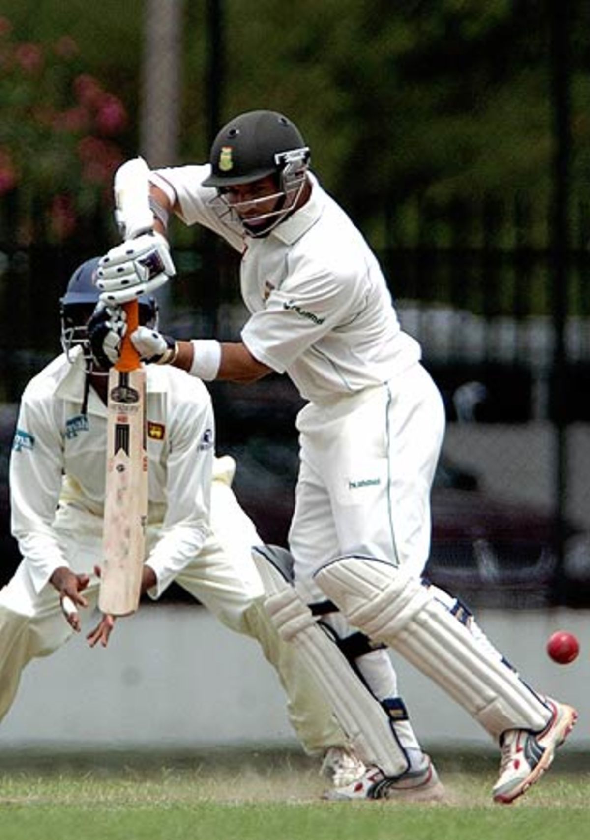 Ashwell Prince walks back after his dismissal