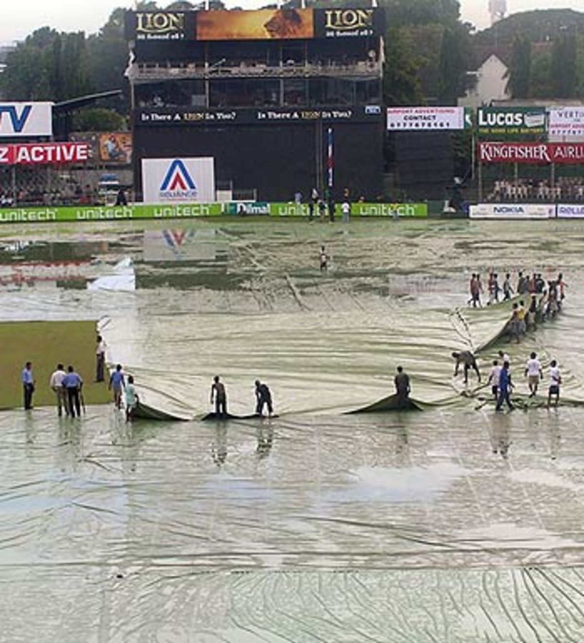 Groundstaff do what they can to improve the dire conditions at the