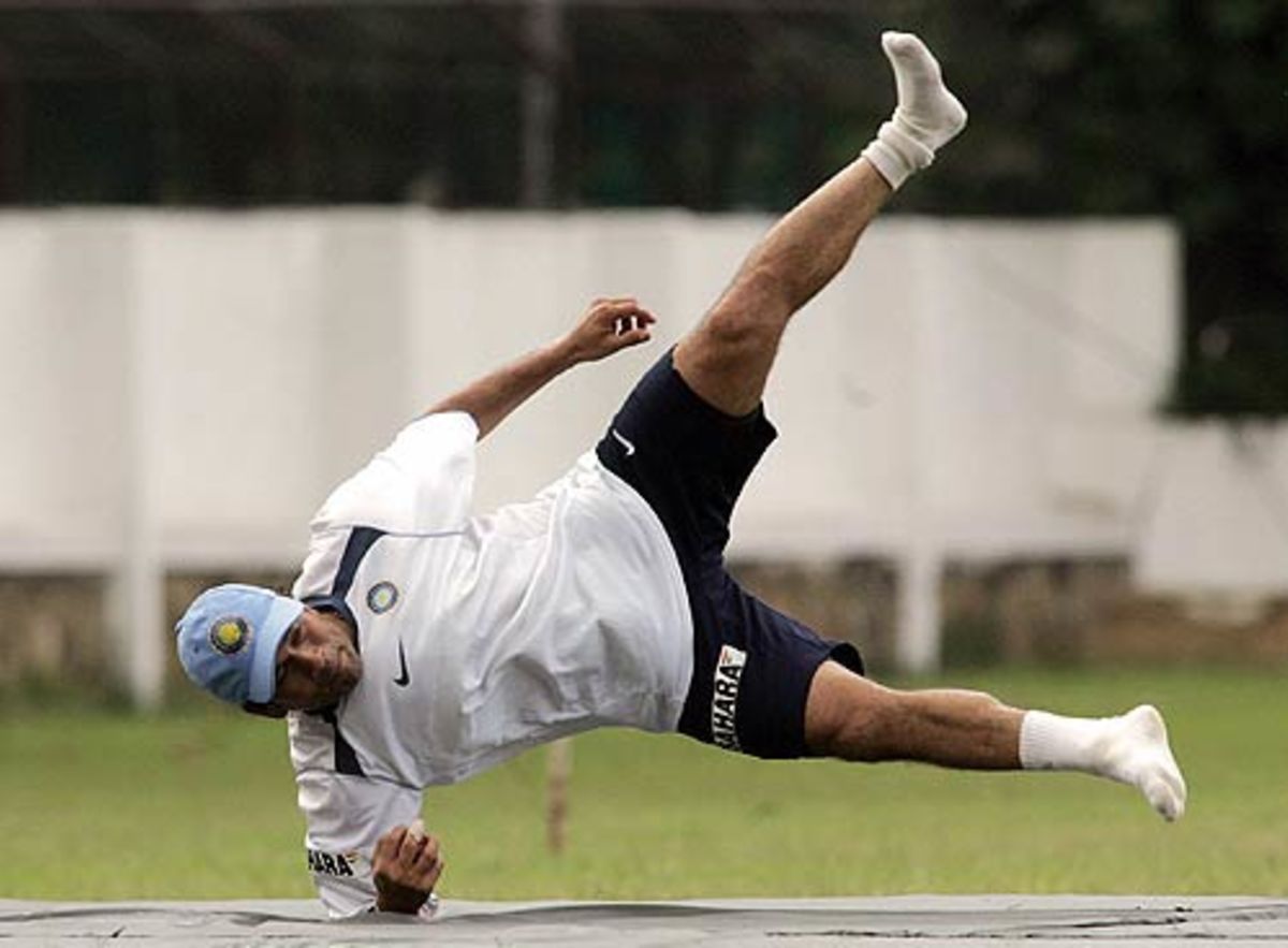 Sachin Tendulkar hits the ground during a fielding drill | ESPNcricinfo.com