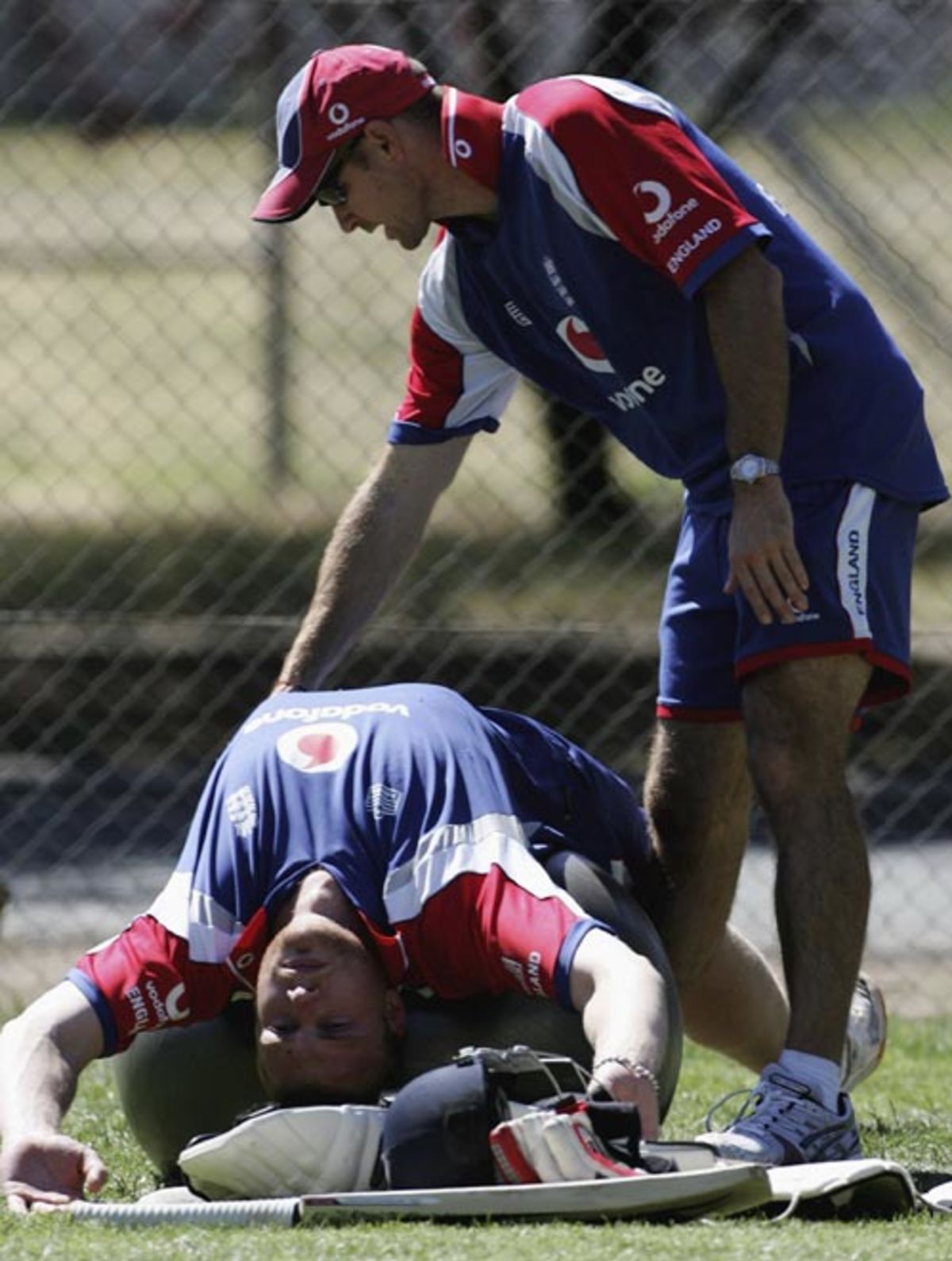 Andrew Flintoff stretches ahead of England's net session in Sydney, November 9, 2006
