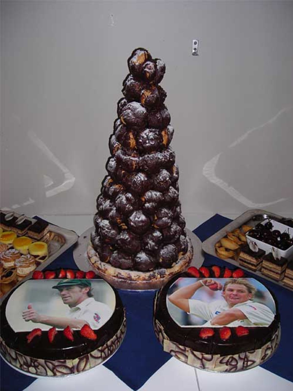 Cakes for the retiring trio - the profiterole mountain is for Justin ...