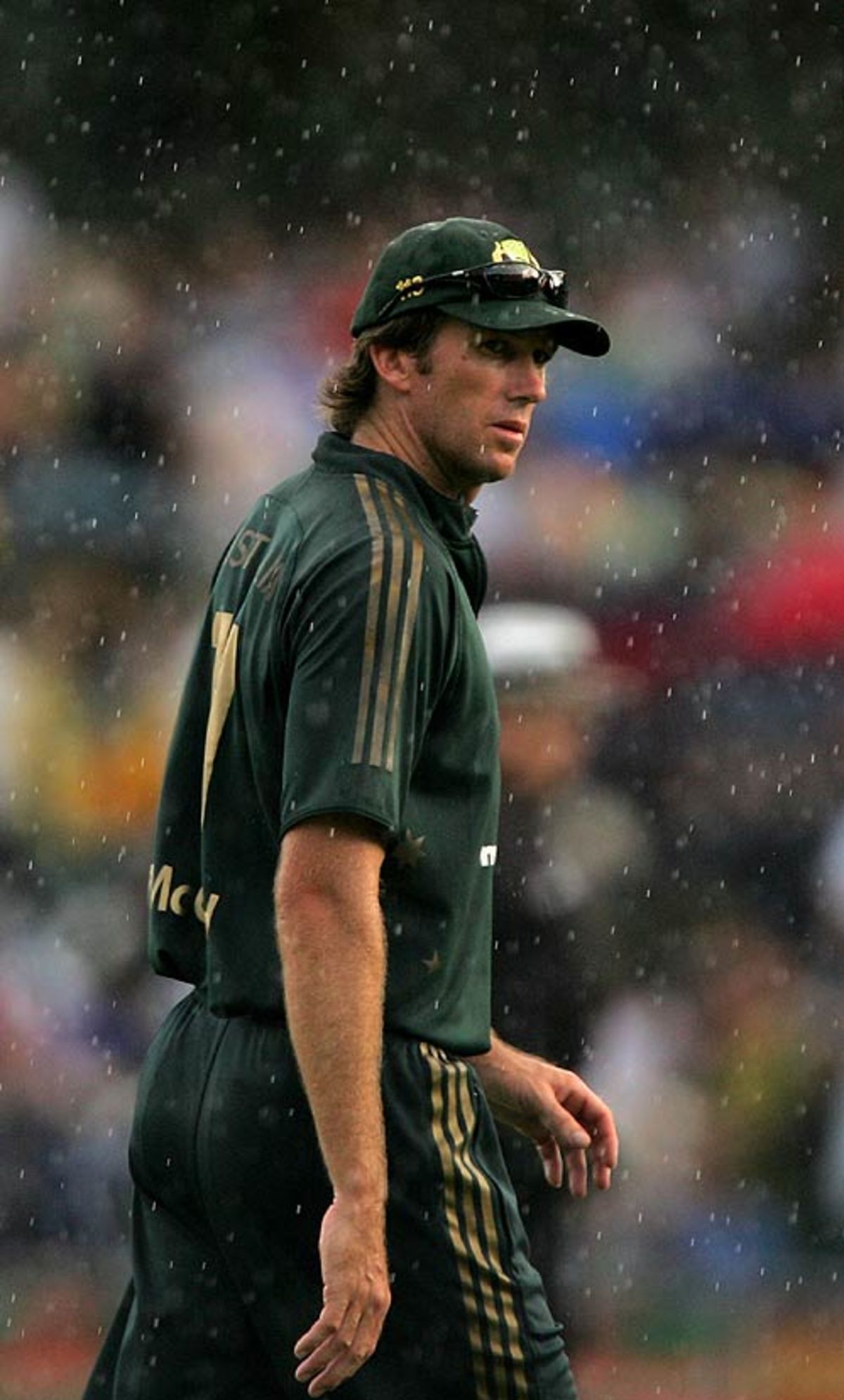 Glenn Mcgrath Stands In The Rain At Sydney