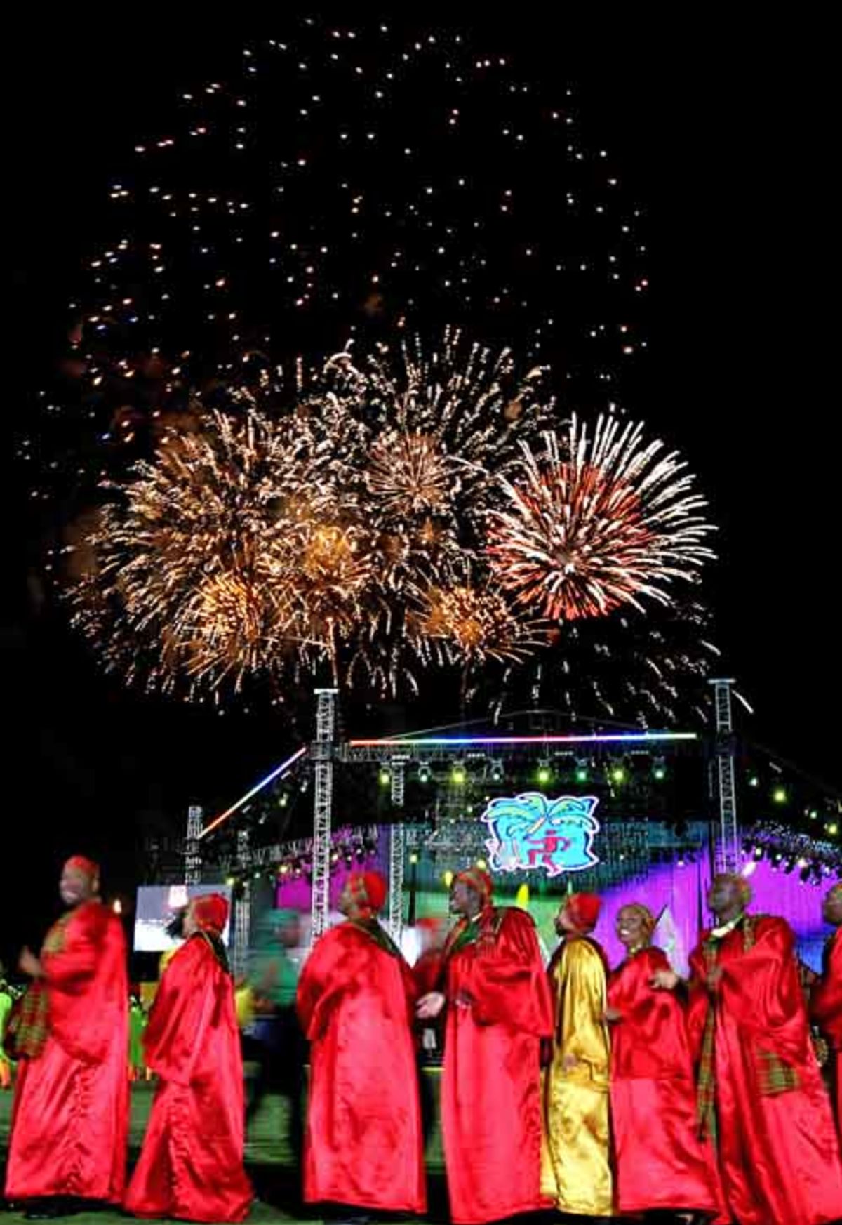 Dancers Perform As Fireworks Illuminate The Night Sky During The Dancers Perform As Fireworks Illuminate The Night Sky During The