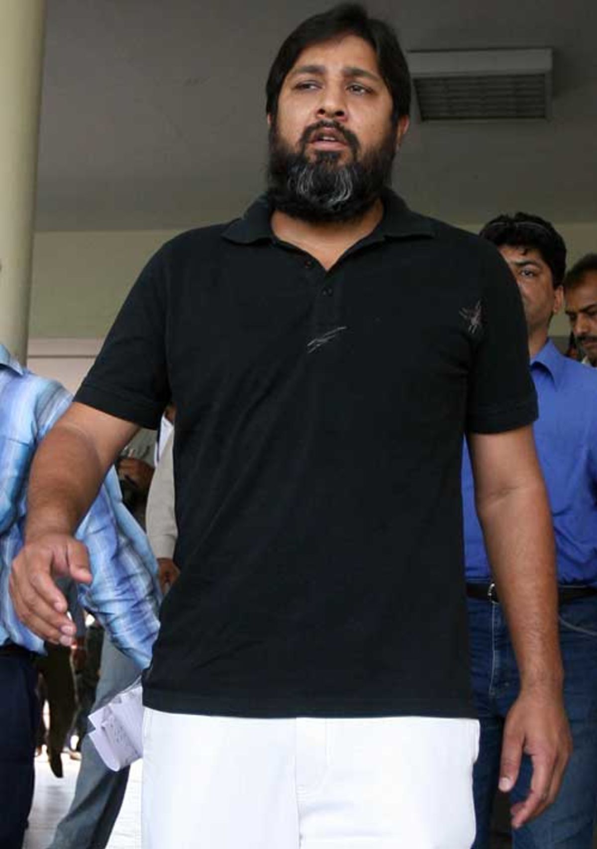 Inzamam-ul-Haq leaves a press conference in Lahore after talking about the 'most traumatic' period of his life, Lahore, March 31, 2007