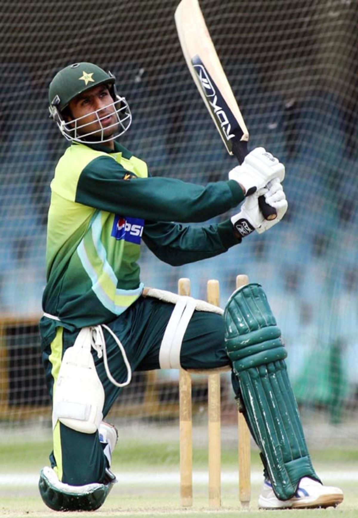 Shoaib Malik follows the ball during a practice session at the Gaddafi ...