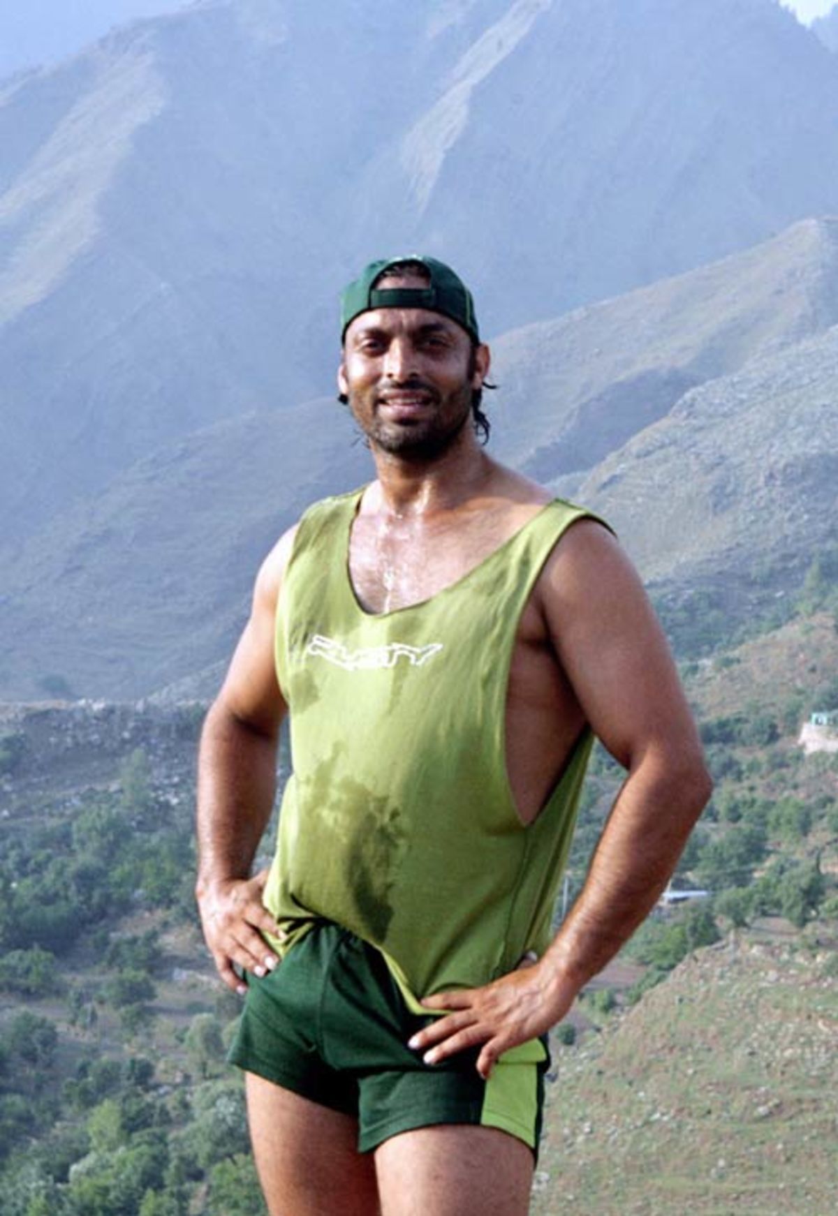 Shoaib Akhtar takes a break during military training at a base in Abbottabad, Pakistan, June 21, 2007