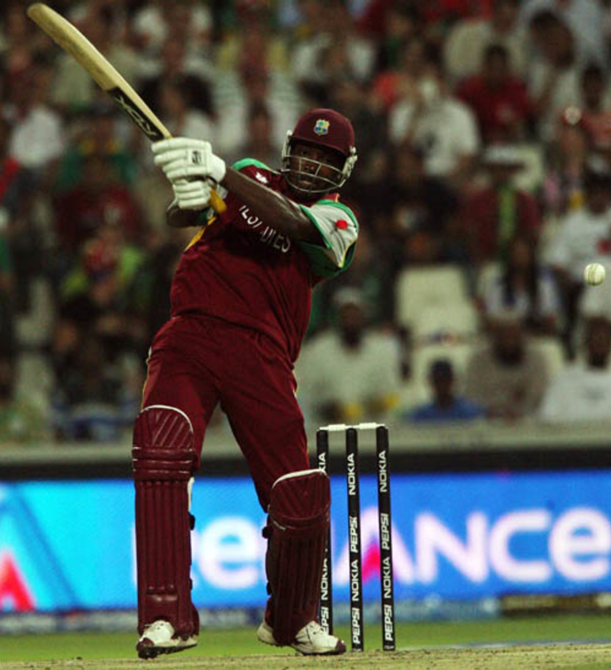 Chris Gayle blasts one through the off side during his hundred ...