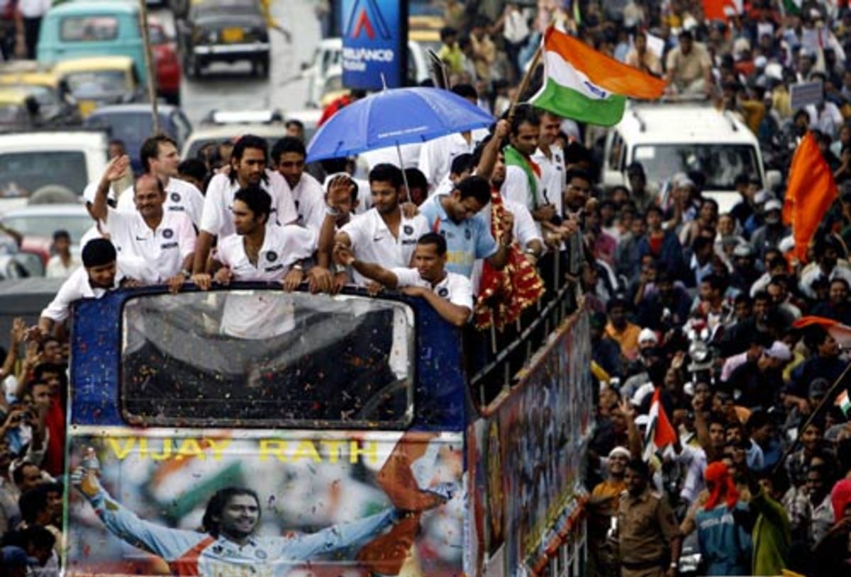 a-indian-fan-clears-a-barbed-wire-fence-to-get-a-closer-look-at-the