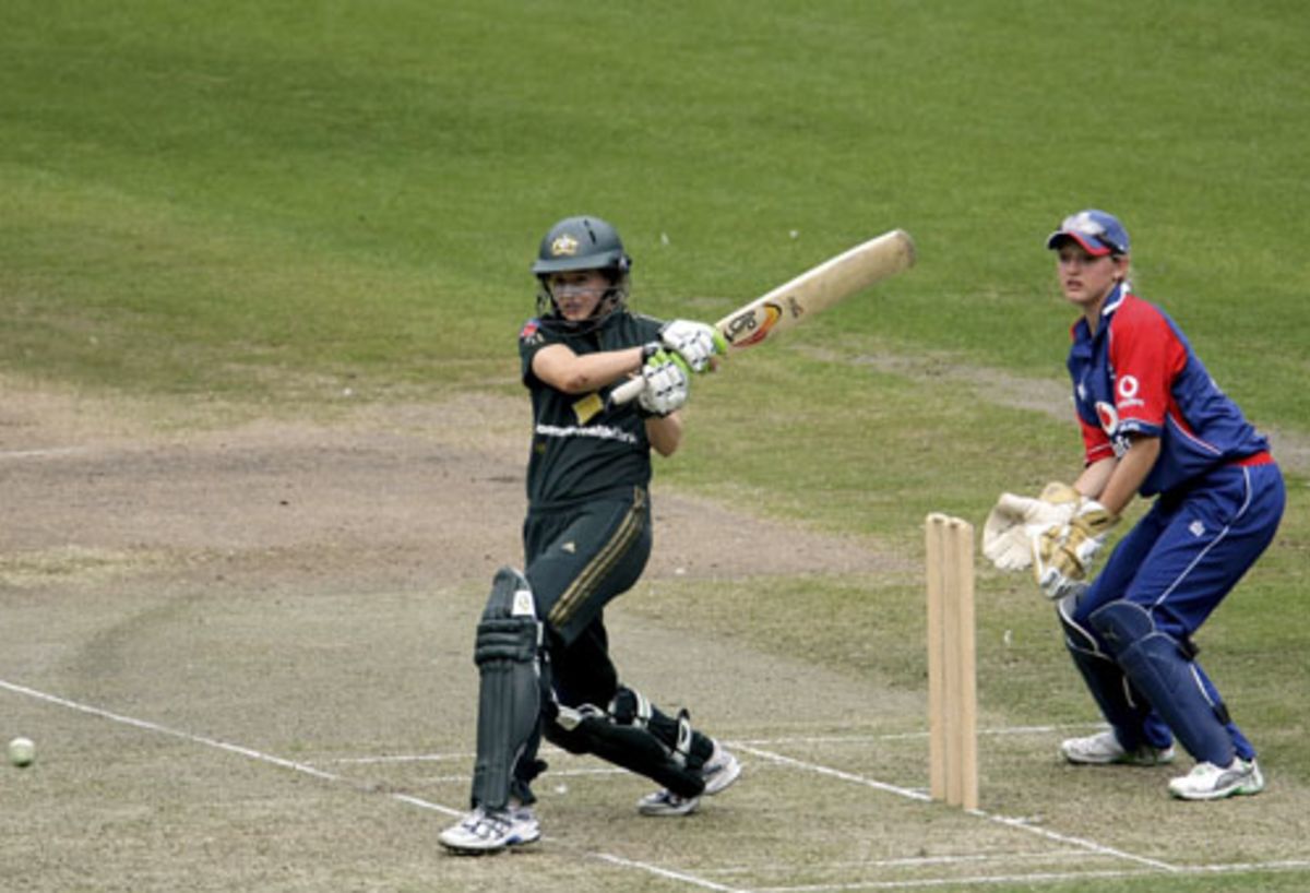 Ellyse Perry turns the ball to the leg side while Sarah Taylor looks on ...