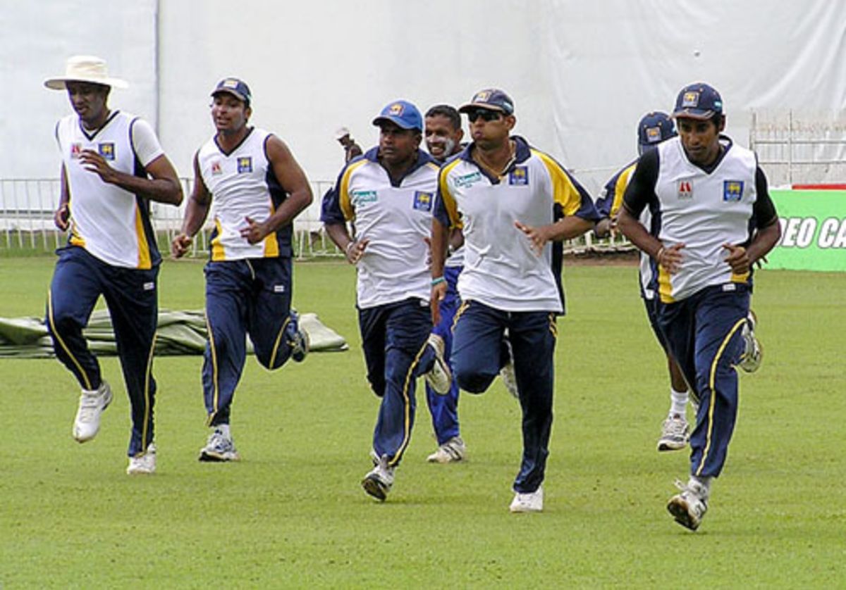 The Sri Lankan team gather to listen to coach Trevor Bayliss ...