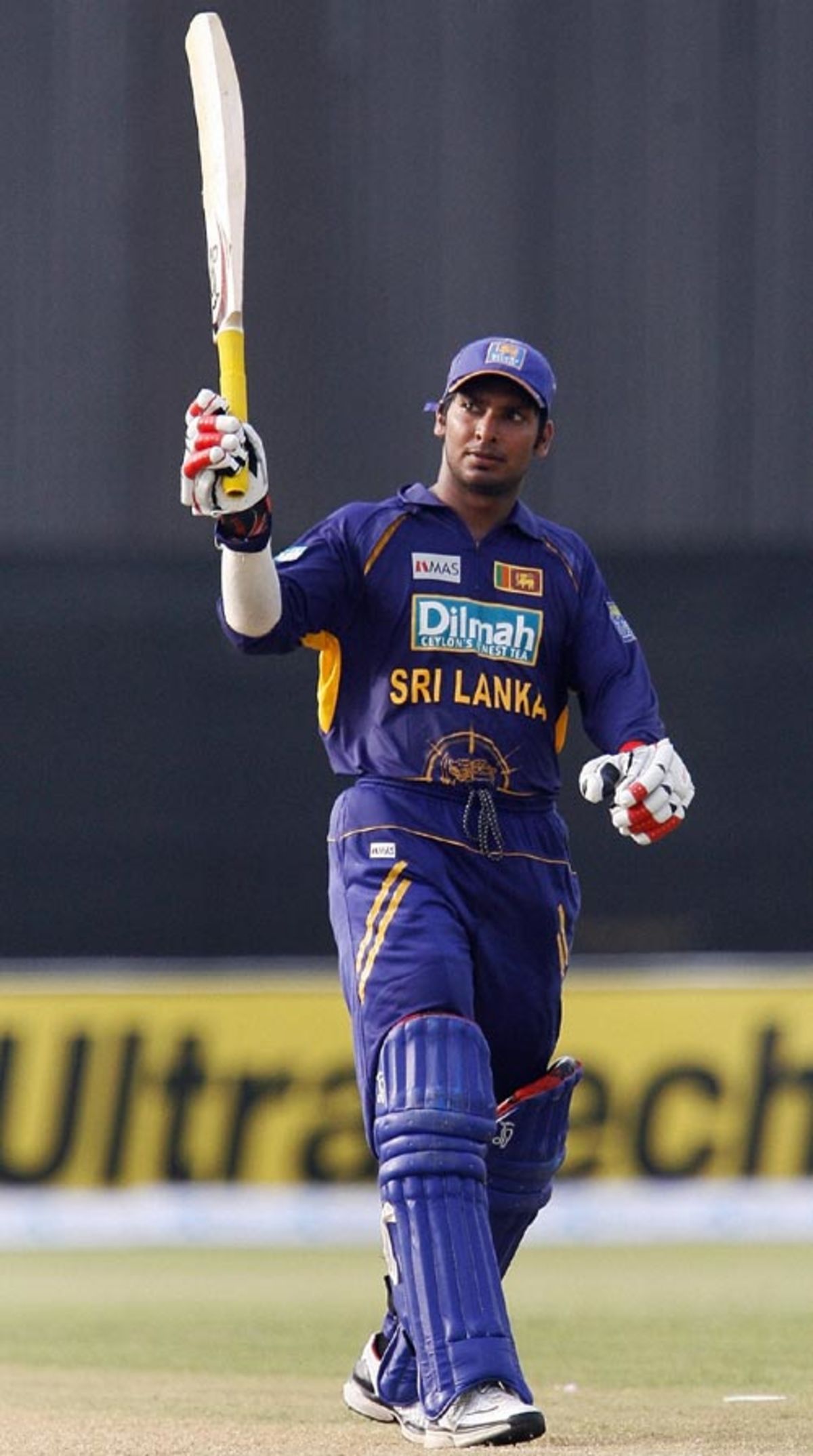 Kumar Sangakkara raises his bat after making a century | ESPNcricinfo.com