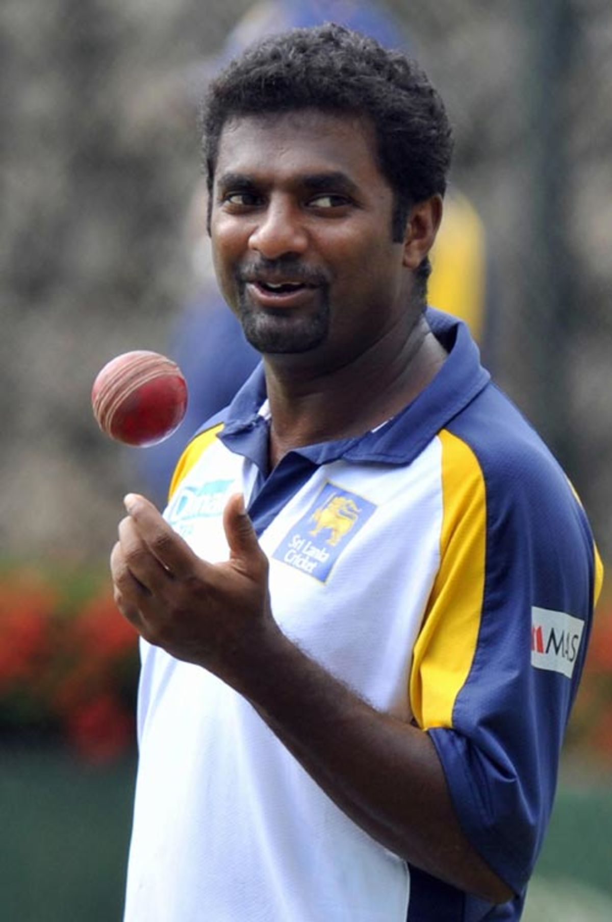 Muttiah Muralitharan prepares to bowl during a training session ...