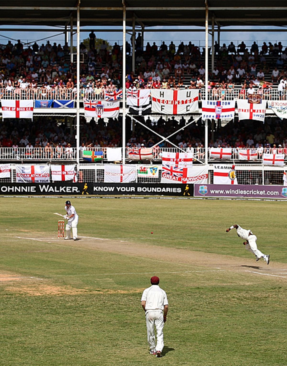 Paul Collingwood waits for a delivery in front of a host of Barmy Army fans at the Antigua Recreation Ground, West Indies v England, 3rd Test, Antigua, February 16, 2009