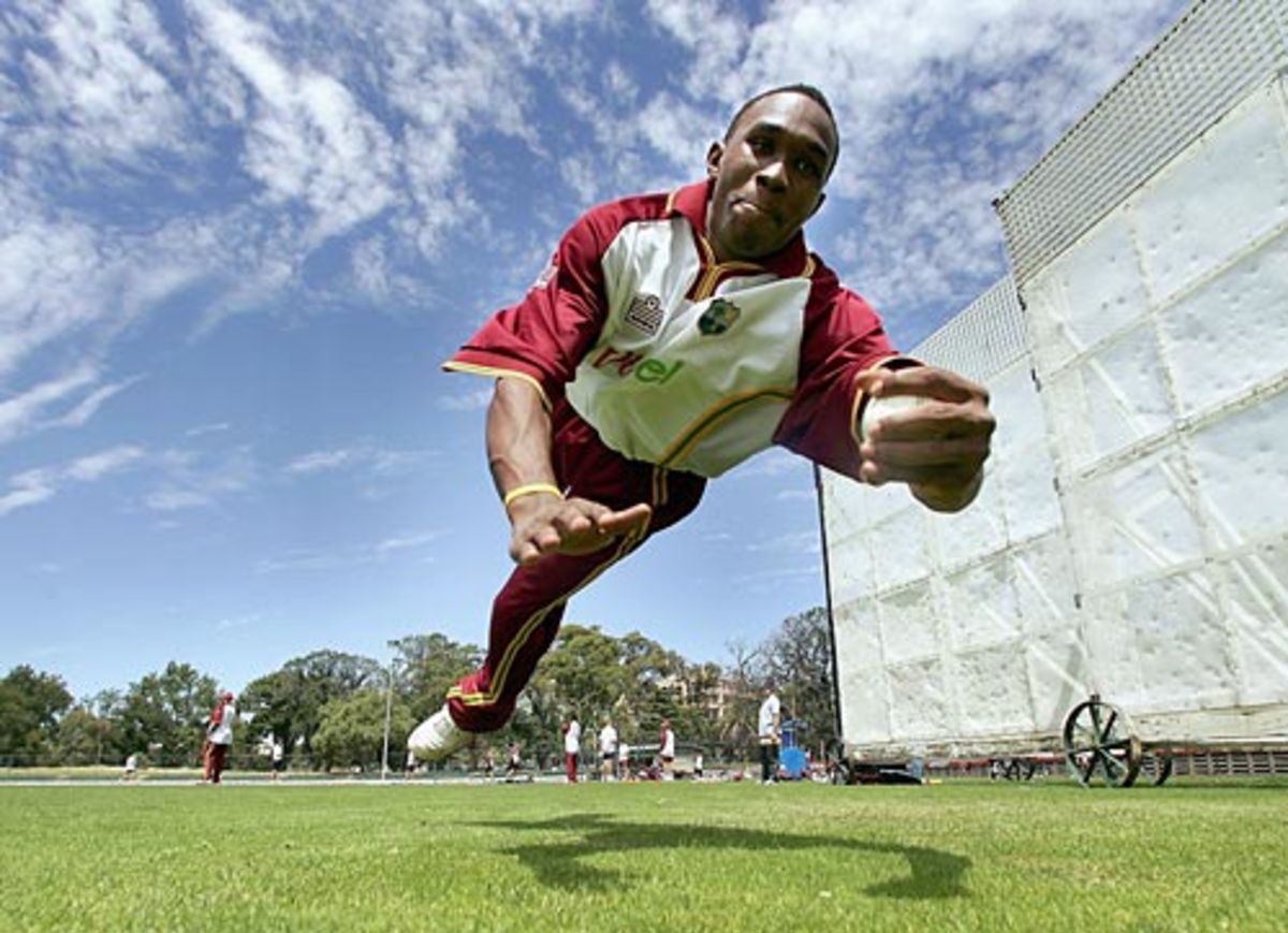 Dwayne Bravo dives for a catch during West Indies' fielding practice at Melbourne's Junction Oval, January 3, 2005