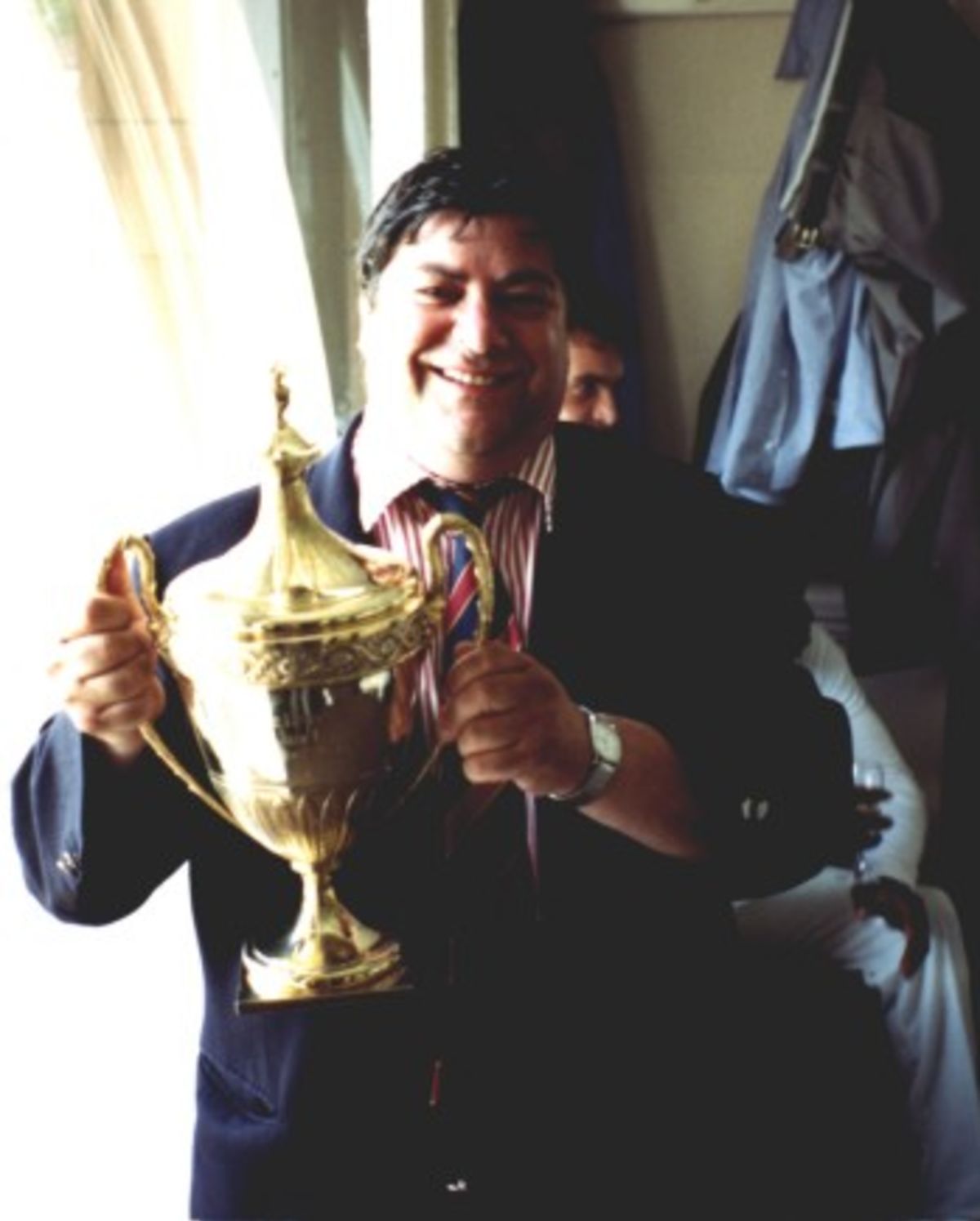 Vic Isaacs Hampshire scorer with Benson & Hedges Trophy in the players dressing room at Lord's.