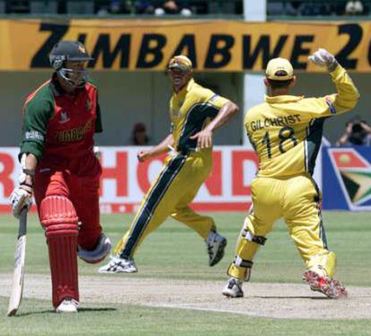 Andy Flower makes his ground only to see Gilchrist prepare to run