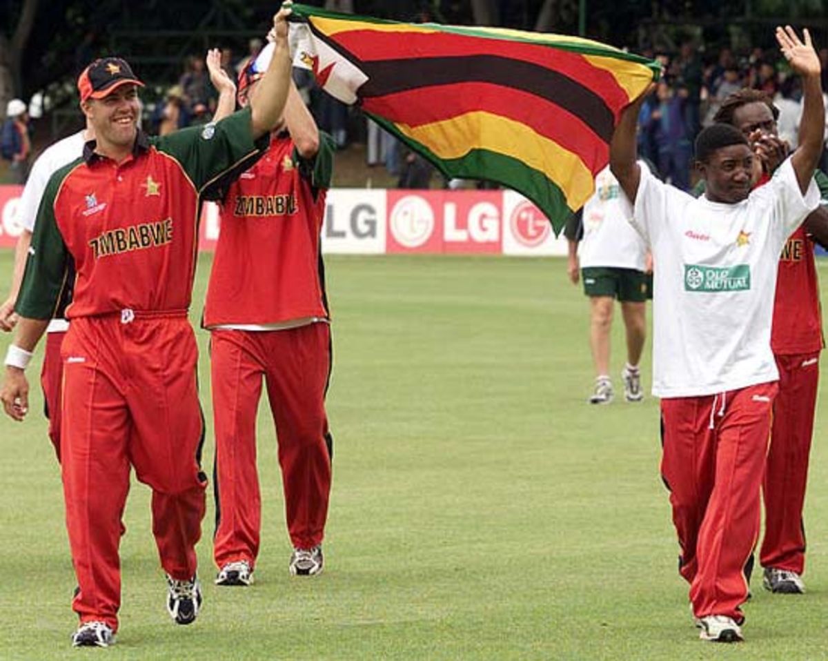 Zimbabwe cricket team walk around the grounds to celebrate qualifying