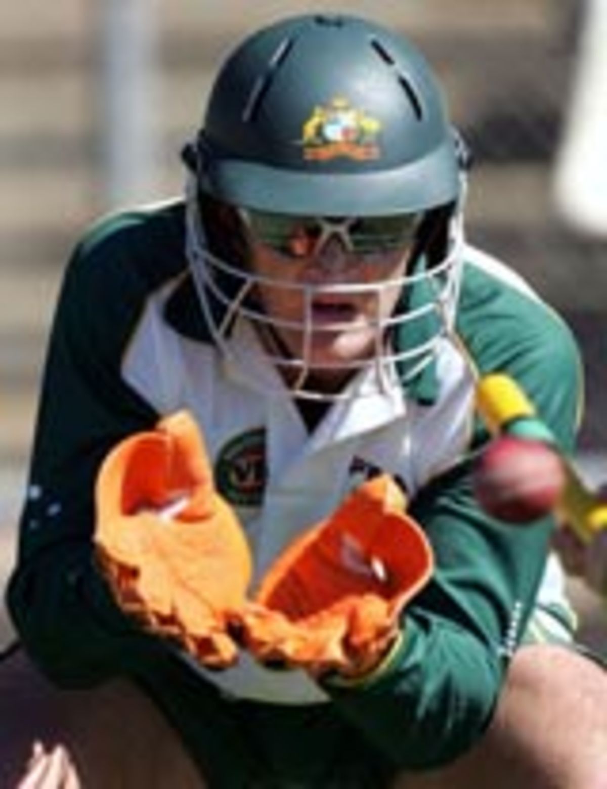 Adam Gilchrist catches a ball in training